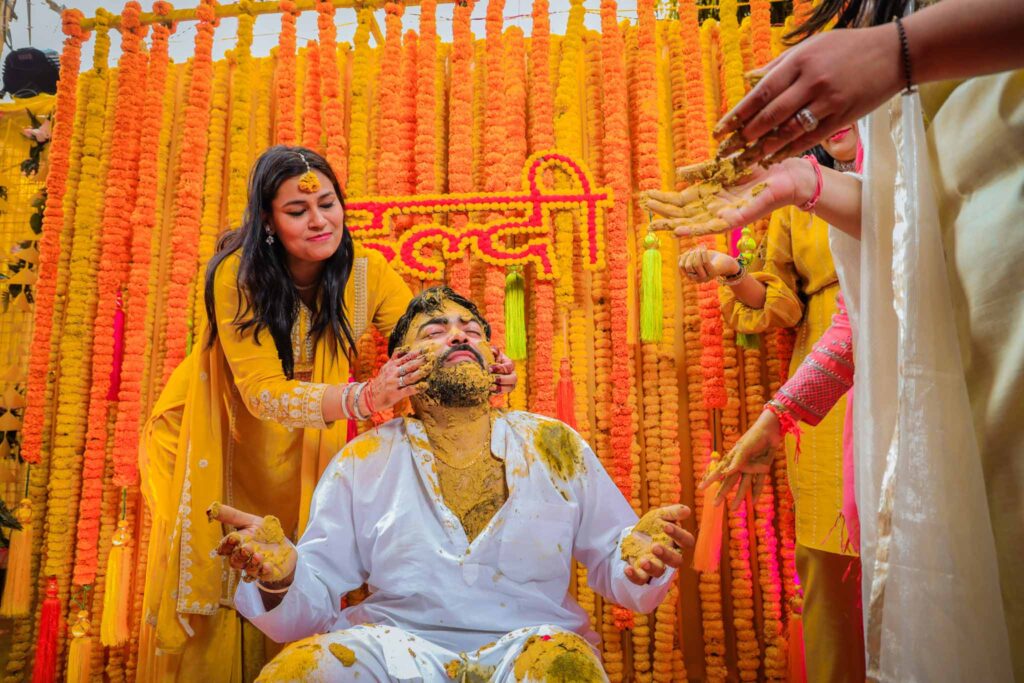 Groom enjoying with family during his haldi ceremony
