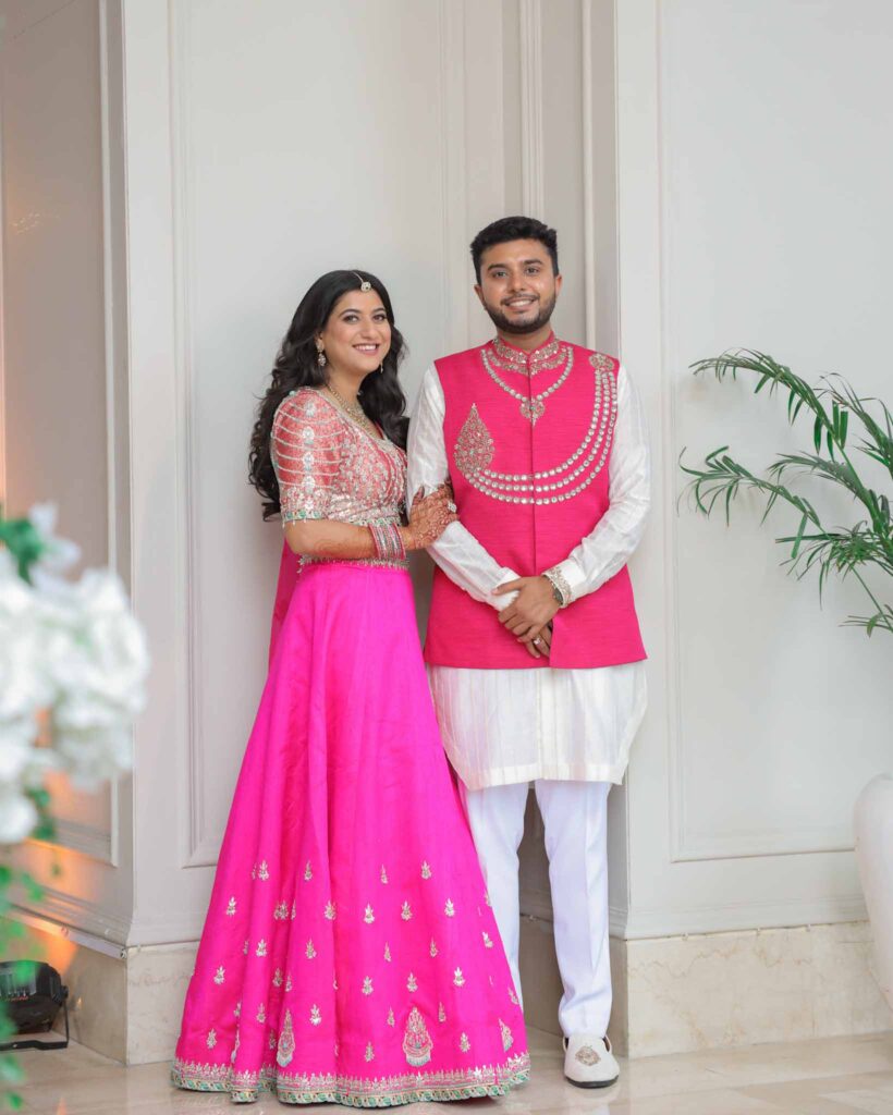bride and groom in pink ethnic outfits