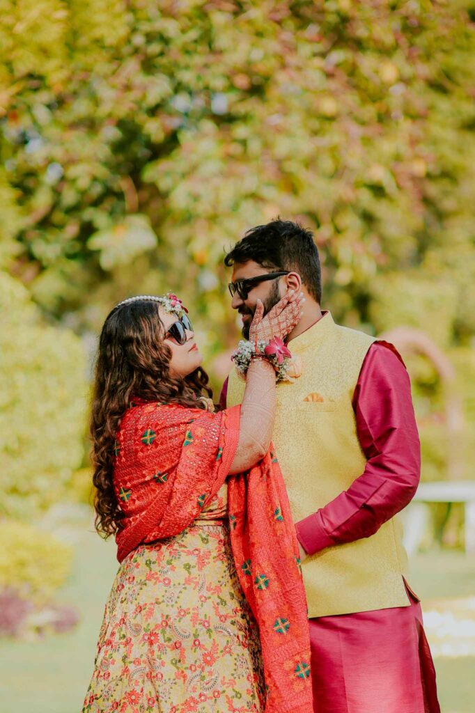 Bride and groom looking at each other during haldi