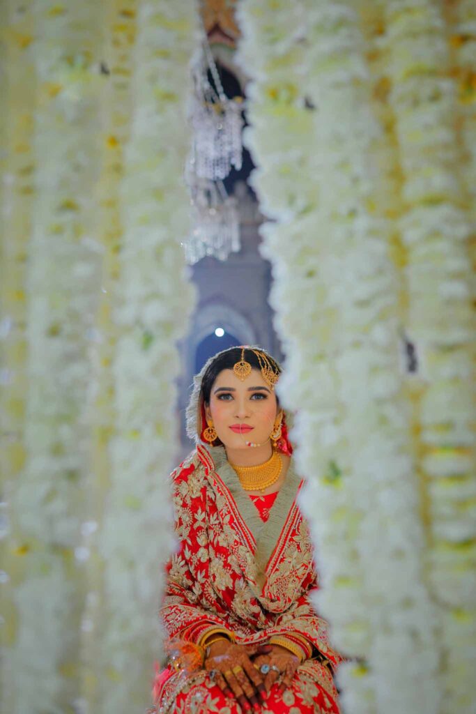close up view of a bride in red shrara