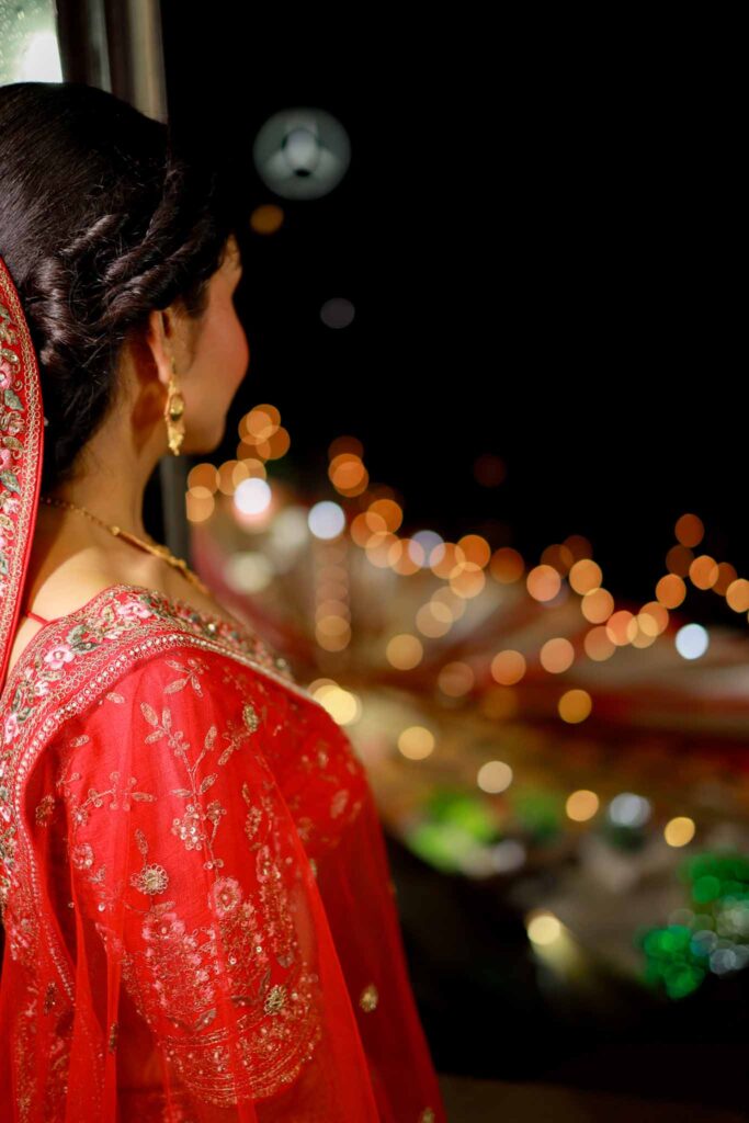 side view of a bide in red lehnga
