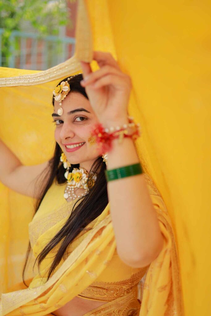 smiling bride in yellow lehnga