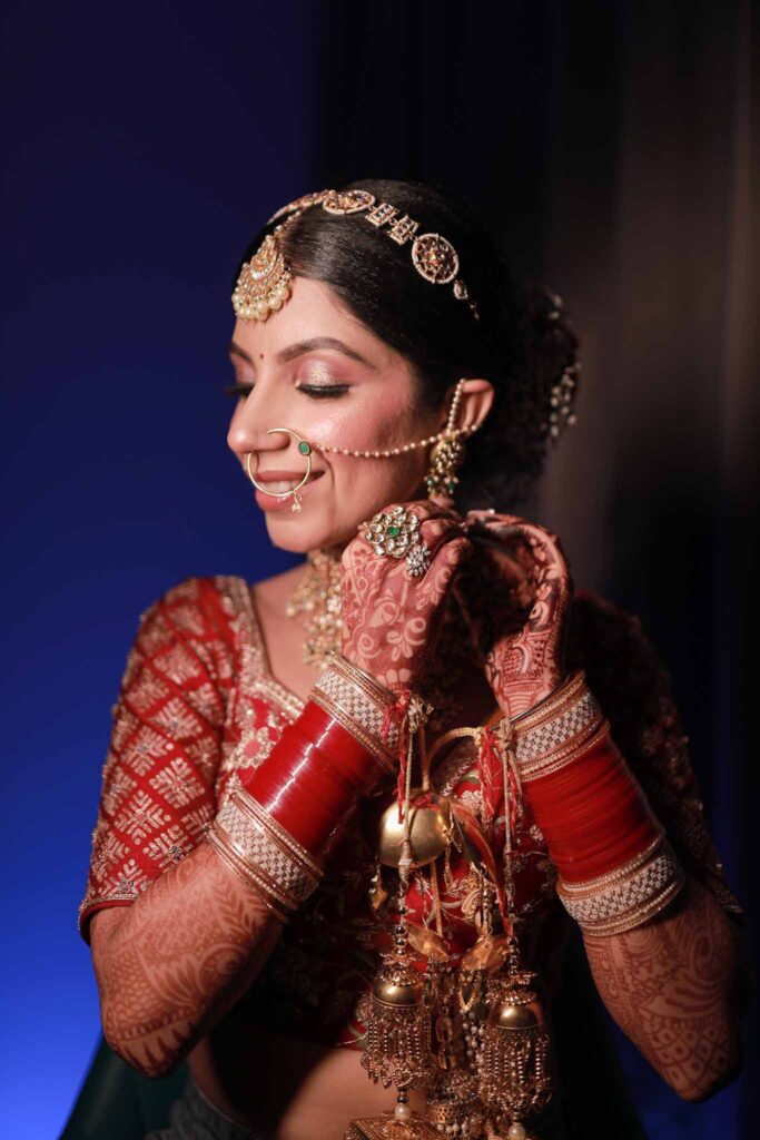 closeup view of a happy bride in red lehnga
