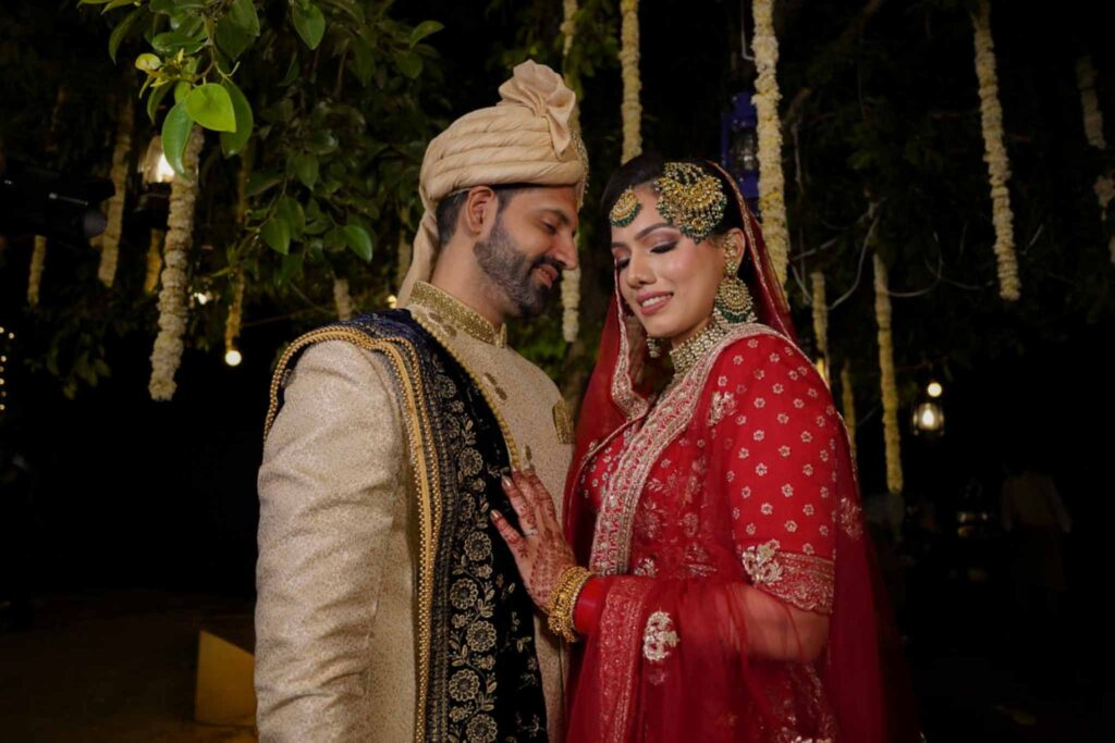 bride in red lehnga and groom
